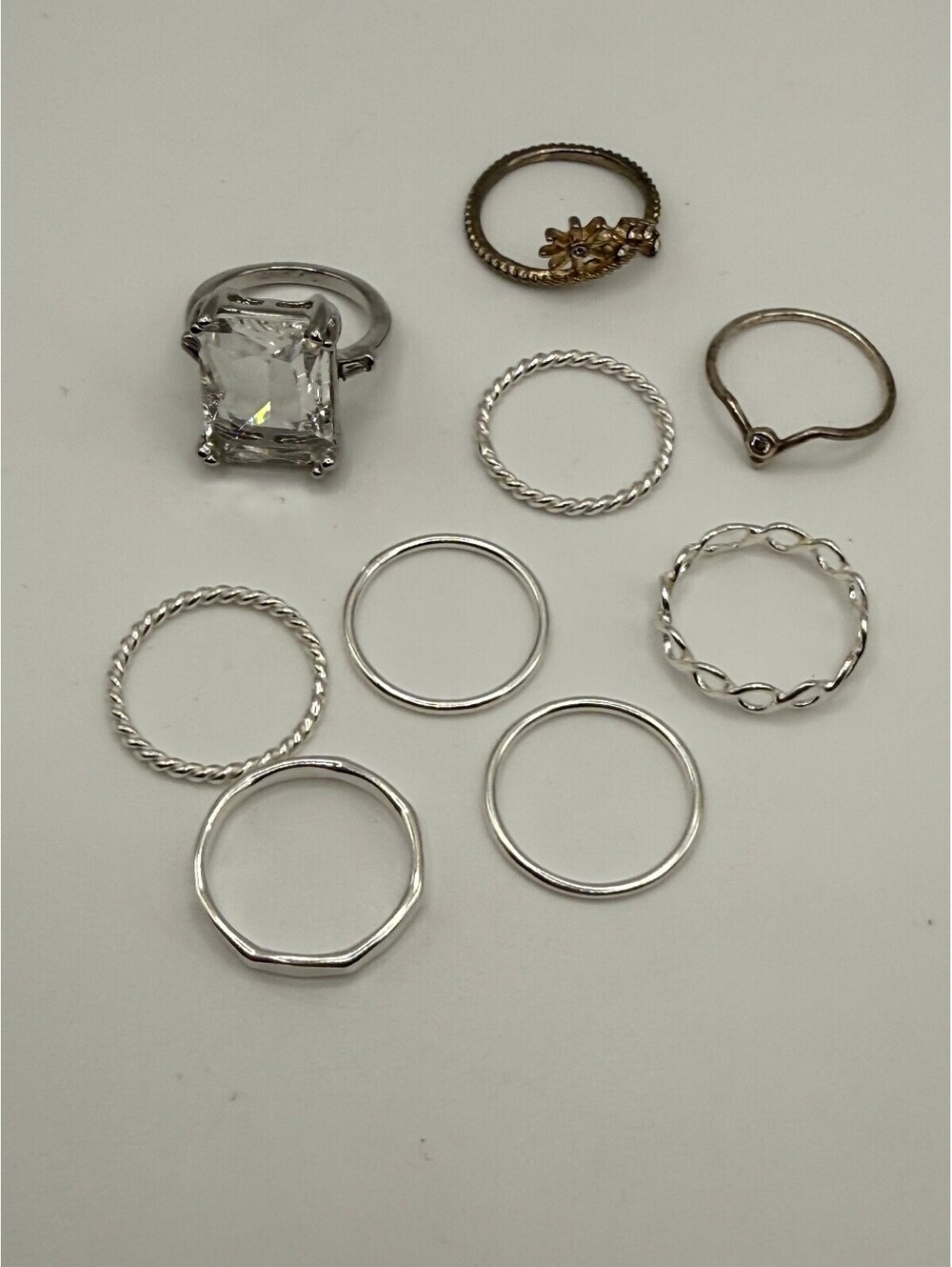 Set of 9 Mixed Metal Rings Including Large Clear Stone and Floral Accent